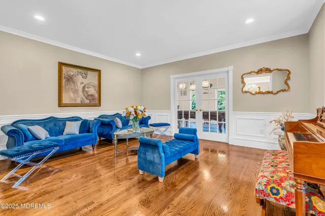 a room with pool table and windows