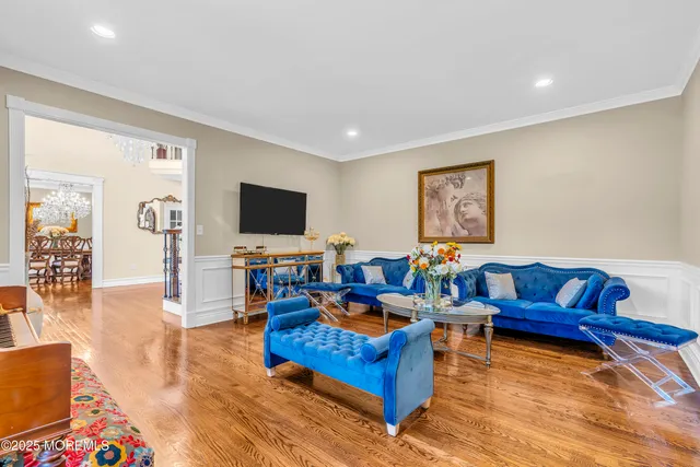 a room with furniture pool table and window