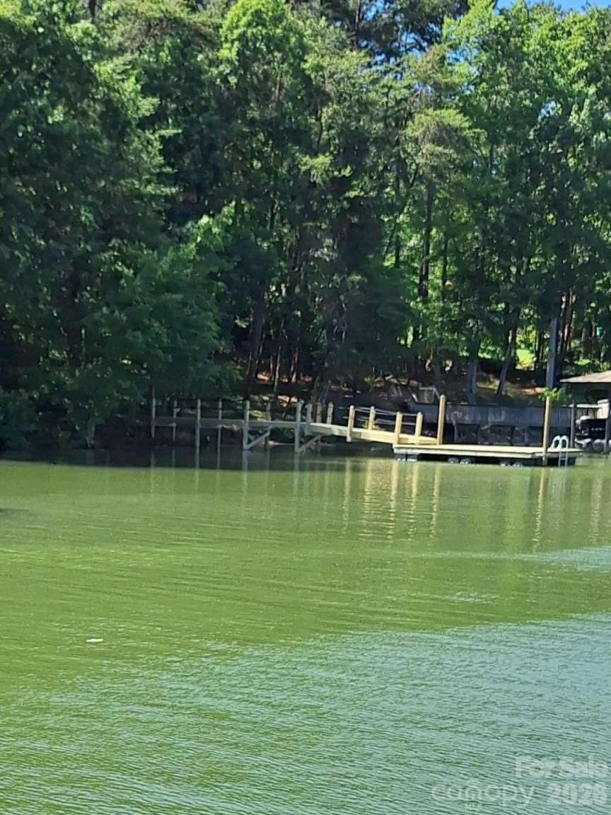 a view of a lake with a house in the background