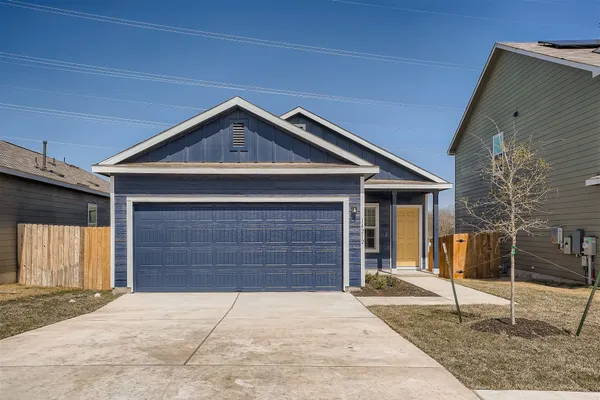 a front view of a house with garage