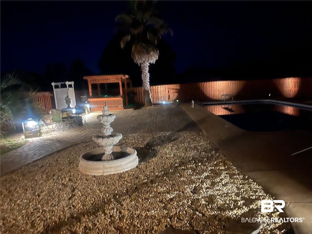 16311 Old Brady Road Bay Minette, AL 36507 - Photo 34 of 38 Outdoor entertaining area featuring an in-ground swimming pool, tiered fountain, wood deck, paver walkway, and a wooden gazebo