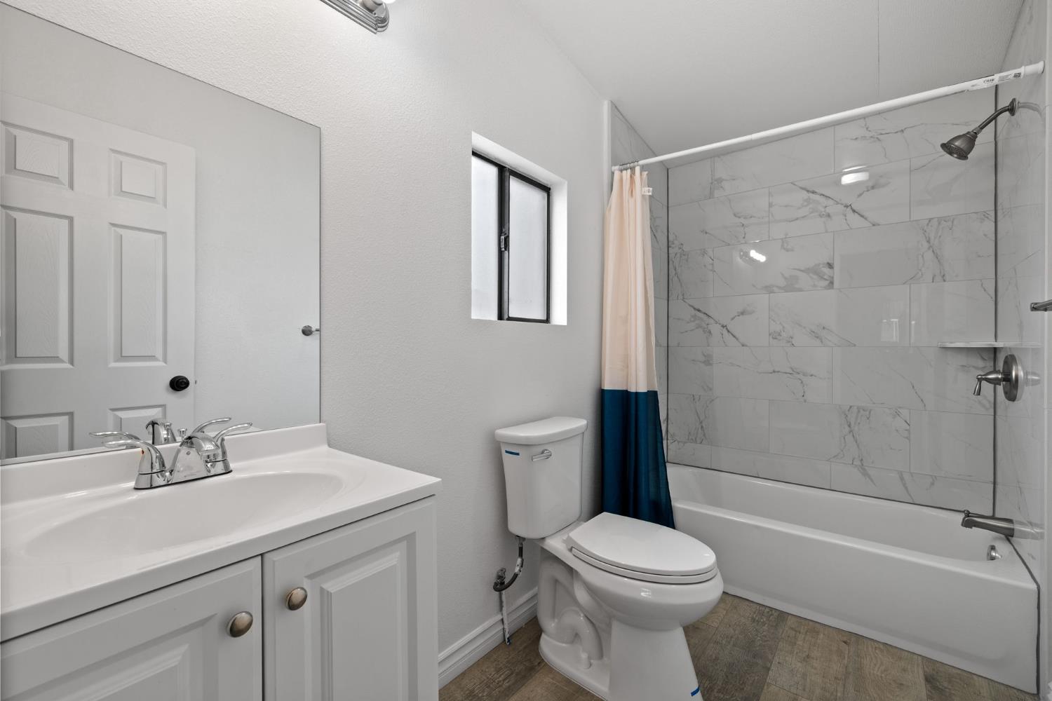 8300 Kern Canyon Road, Unit 156 Bakersfield, CA 93306 - Photo 21 of 40 a bathroom with a sink toilet and shower