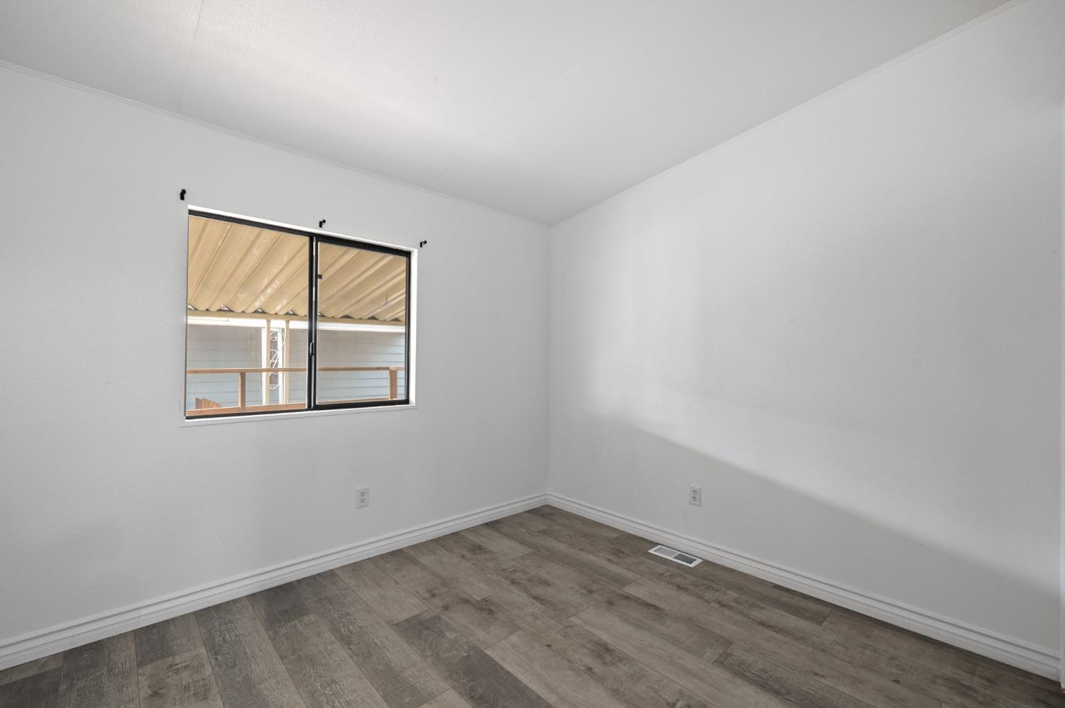 8300 Kern Canyon Road, Unit 156 Bakersfield, CA 93306 - Photo 23 of 40 an empty room with a window