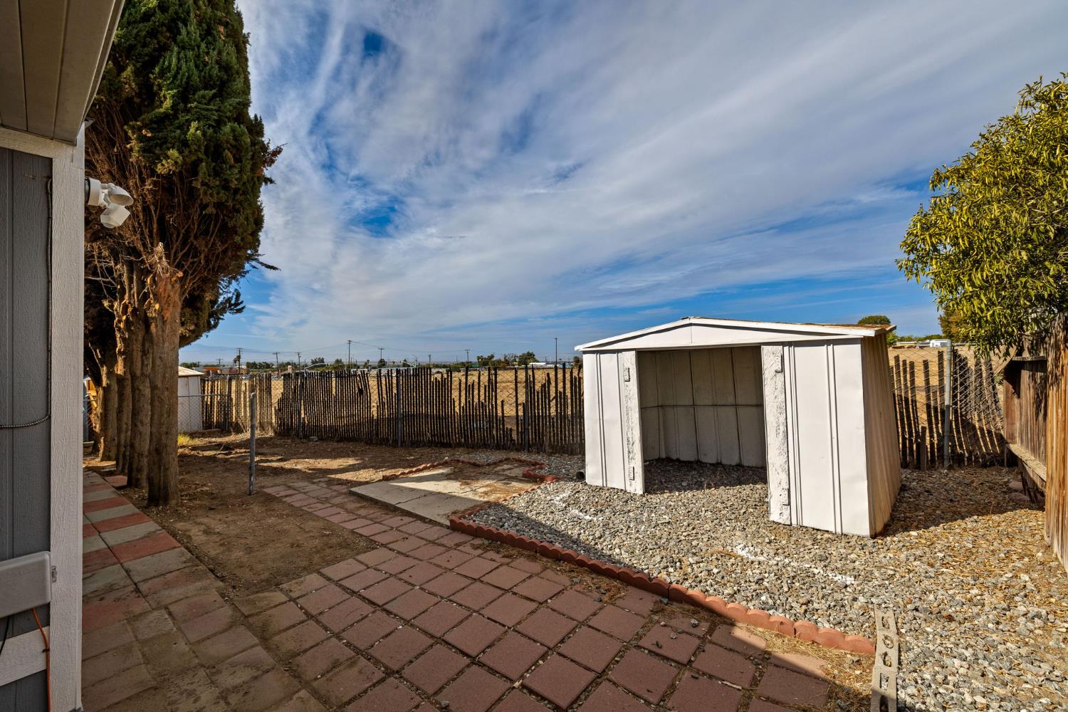 8300 Kern Canyon Road, Unit 156 Bakersfield, CA 93306 - Photo 26 of 40 a view of a house with a yard and pathway