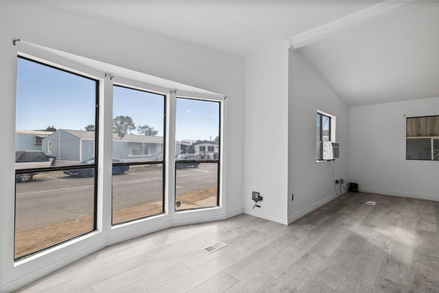 8300 Kern Canyon Road, Unit 156 Bakersfield, CA 93306 - Photo 32 of 40 a view of an empty room with window