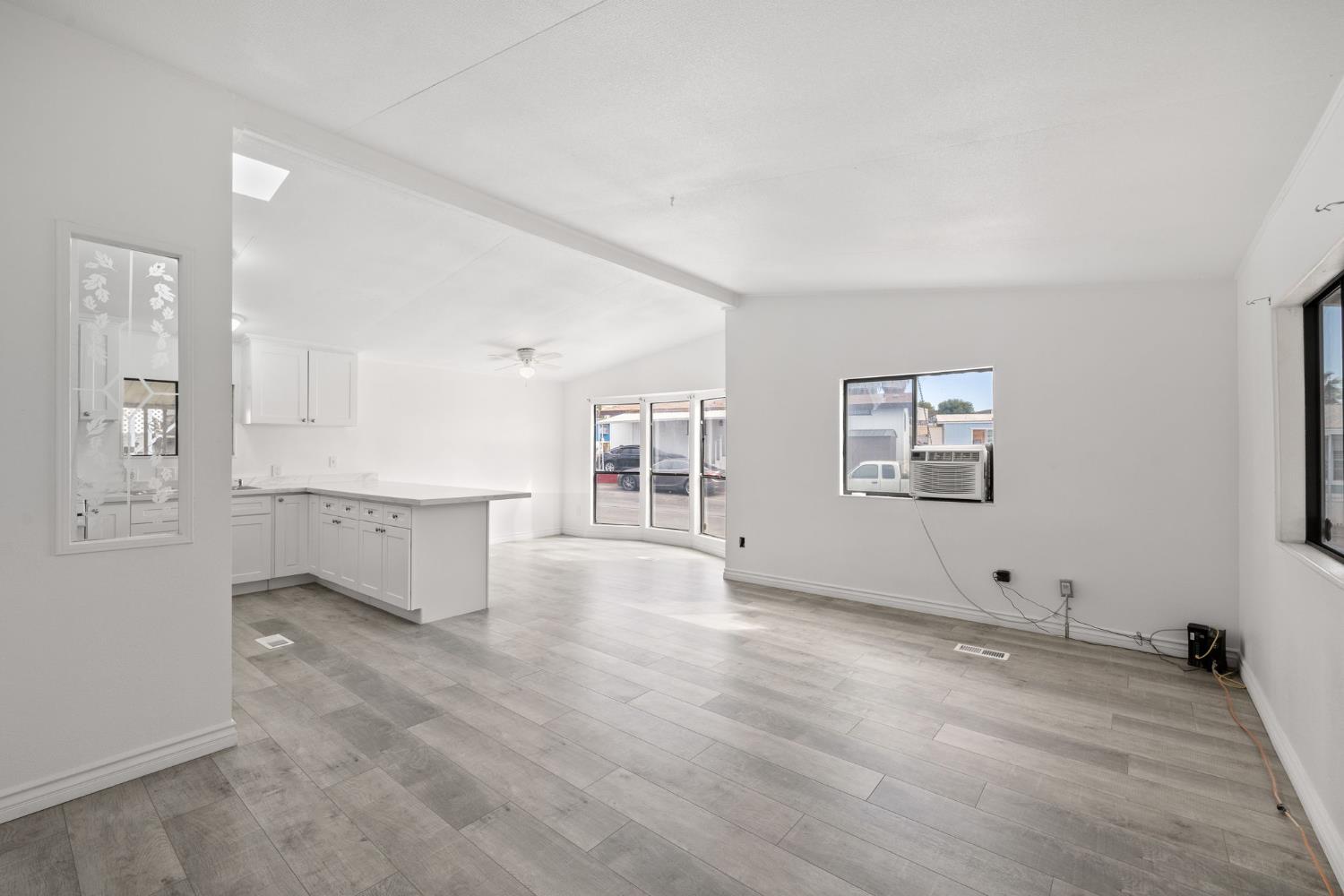 8300 Kern Canyon Road, Unit 156 Bakersfield, CA 93306 - Photo 40 of 40 an empty room with windows