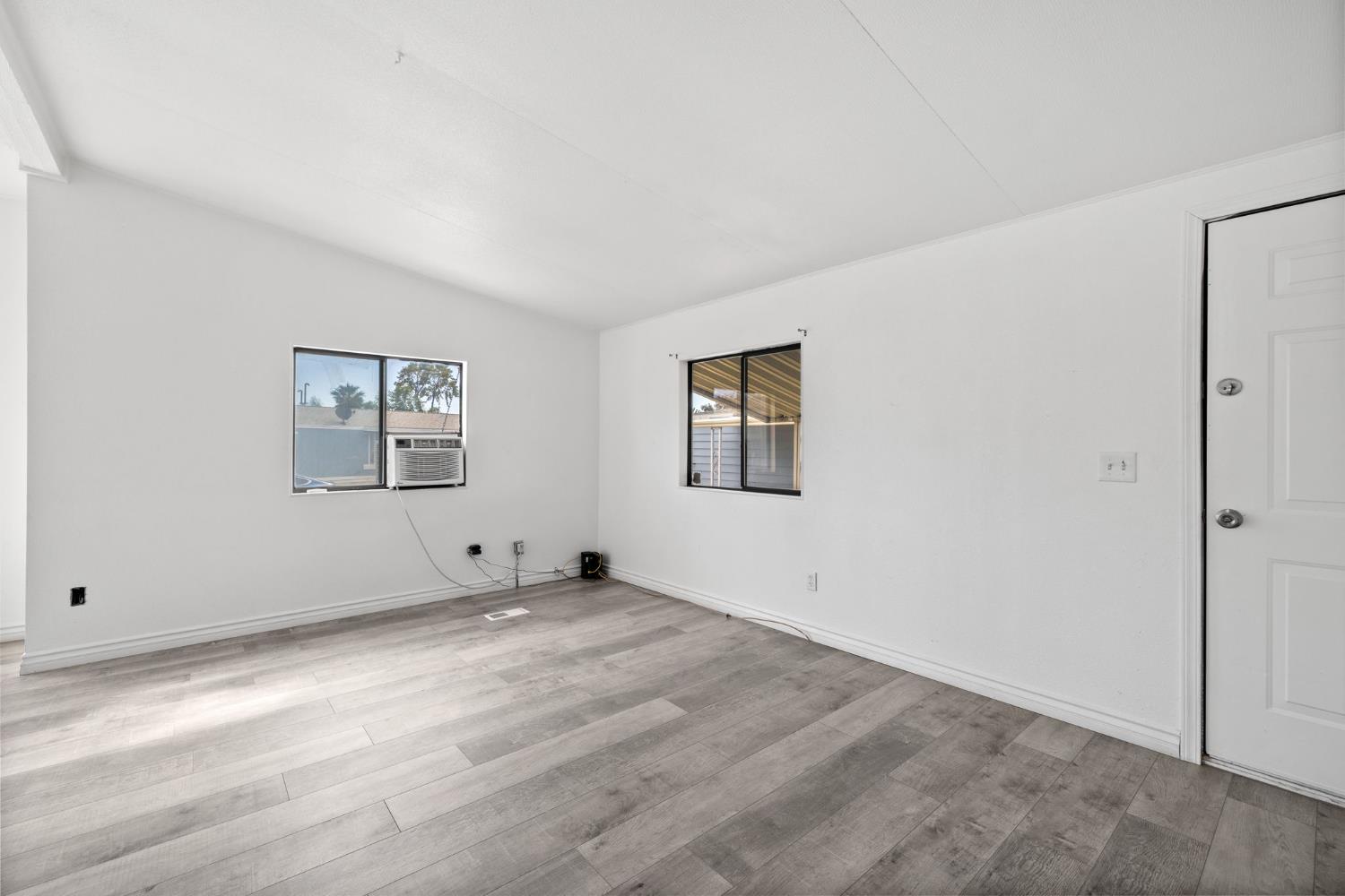 8300 Kern Canyon Road, Unit 156 Bakersfield, CA 93306 - Photo 6 of 40 a view of an empty room with a window