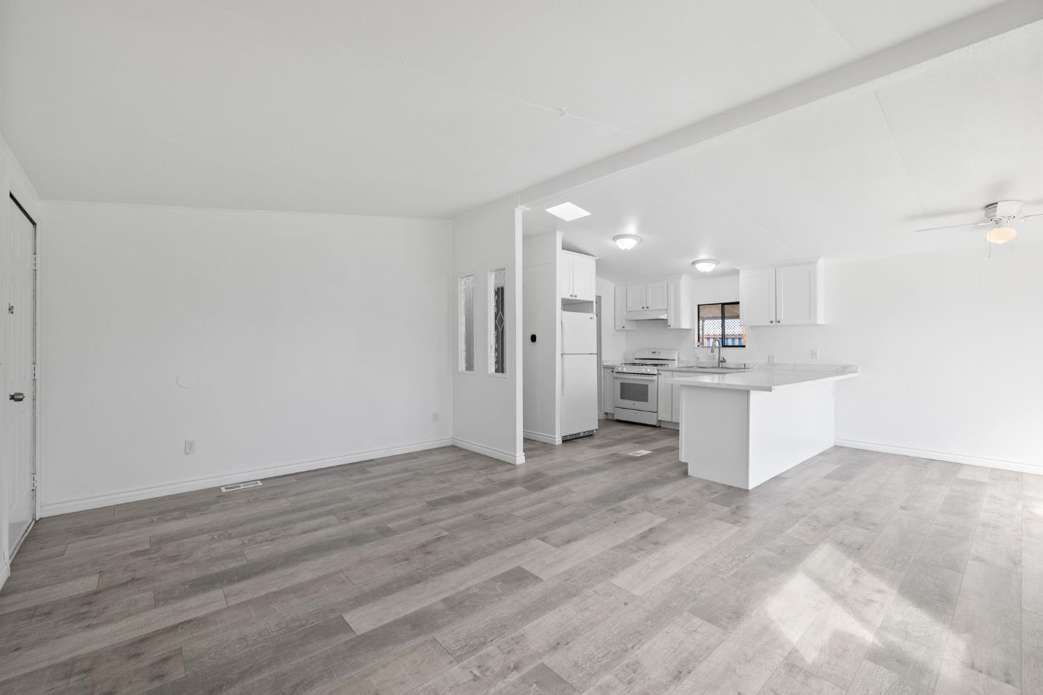 8300 Kern Canyon Road, Unit 156 Bakersfield, CA 93306 - Photo 9 of 40 a view of kitchen with wooden floor