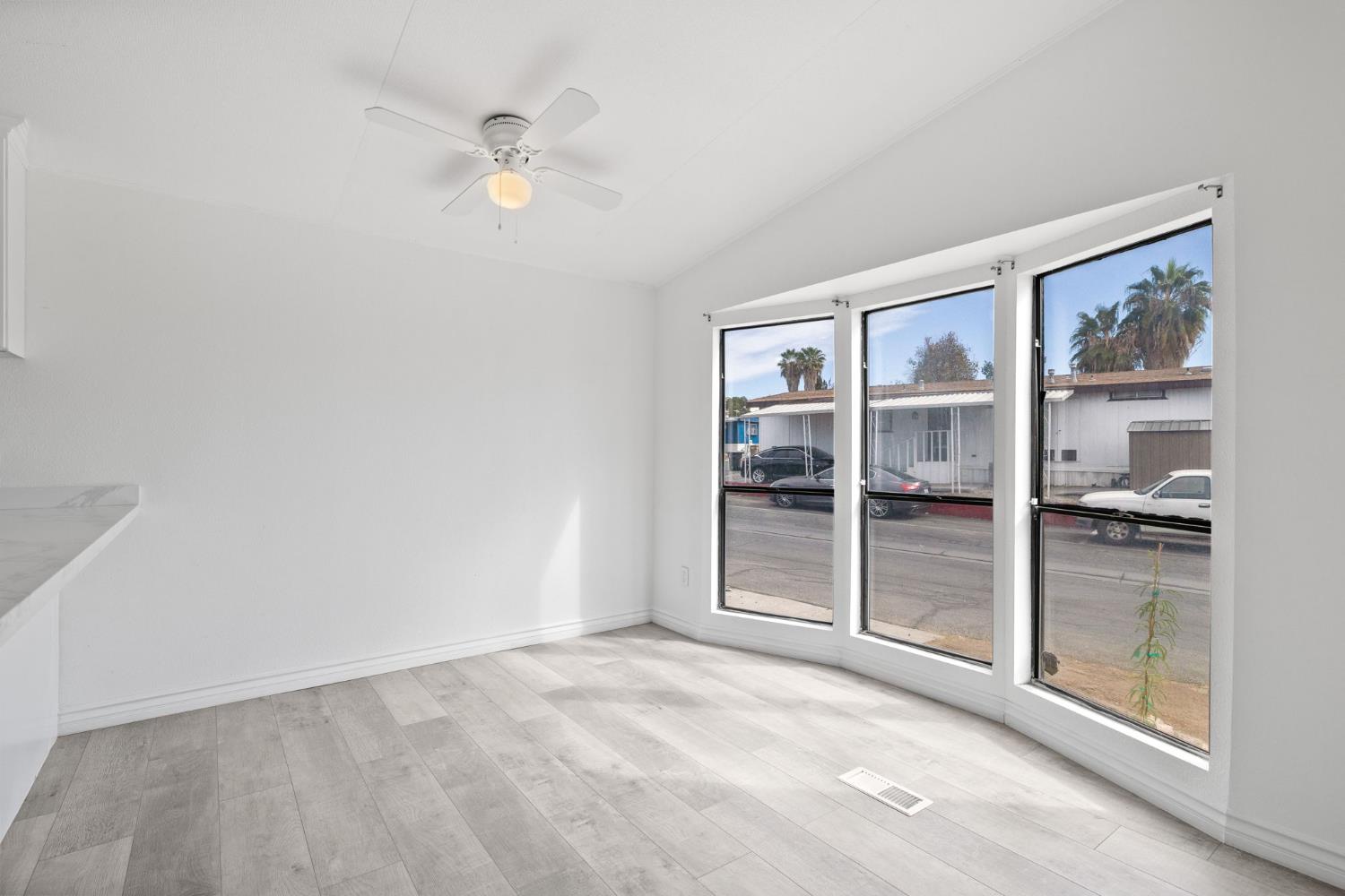 8300 Kern Canyon Road, Unit 156 Bakersfield, CA 93306 - Photo 10 of 40 an empty room with closet and a ceiling fan