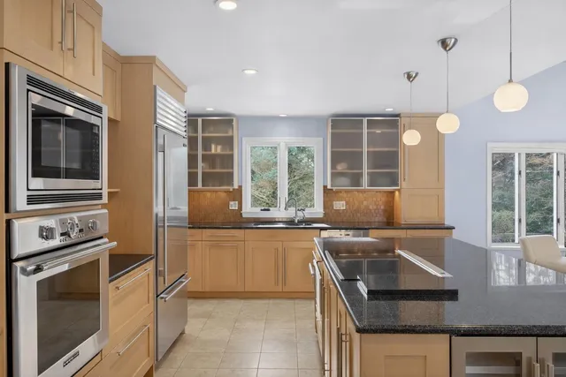 a kitchen with a stove and a microwave