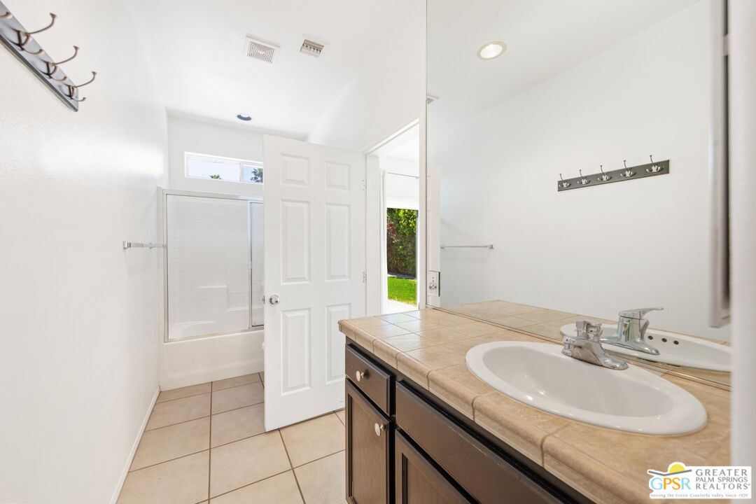 2885 East Sandia Road Palm Springs, CA 92262 - Photo 19 of 30 a bathroom with a sink and a mirror