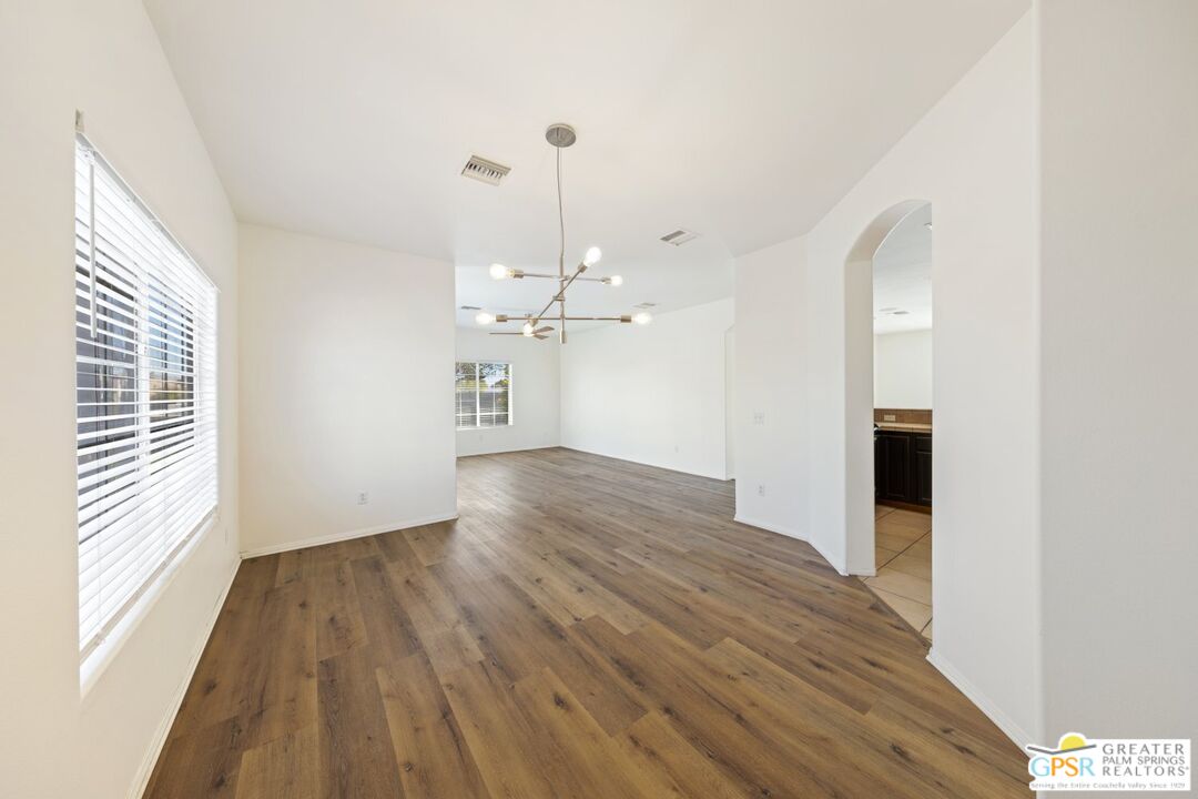 2885 East Sandia Road Palm Springs, CA 92262 - Photo 10 of 30 a view of a room with wooden floor and windows