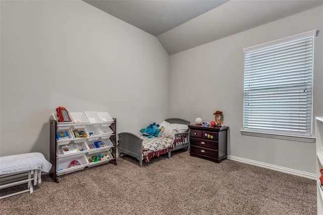 a bedroom with toys and a baby crib