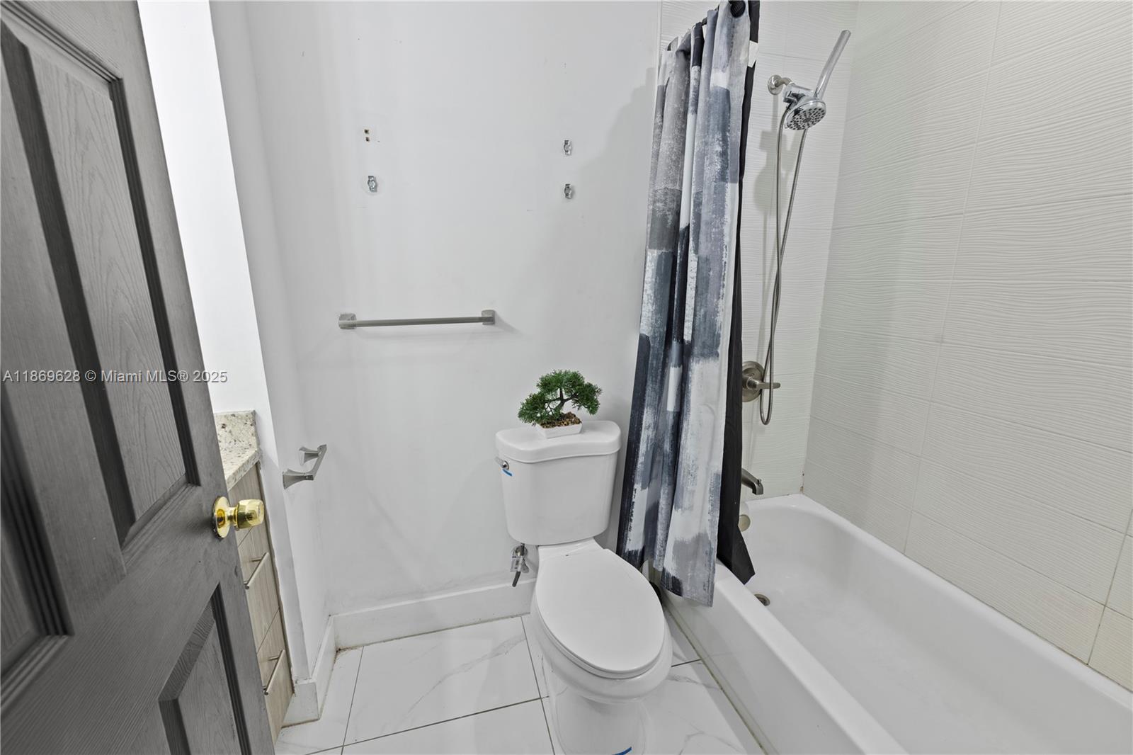 135 Northwest 6th Avenue Dania Beach, FL 33004 - Photo 14 of 26 a bathroom with a toilet and a shower