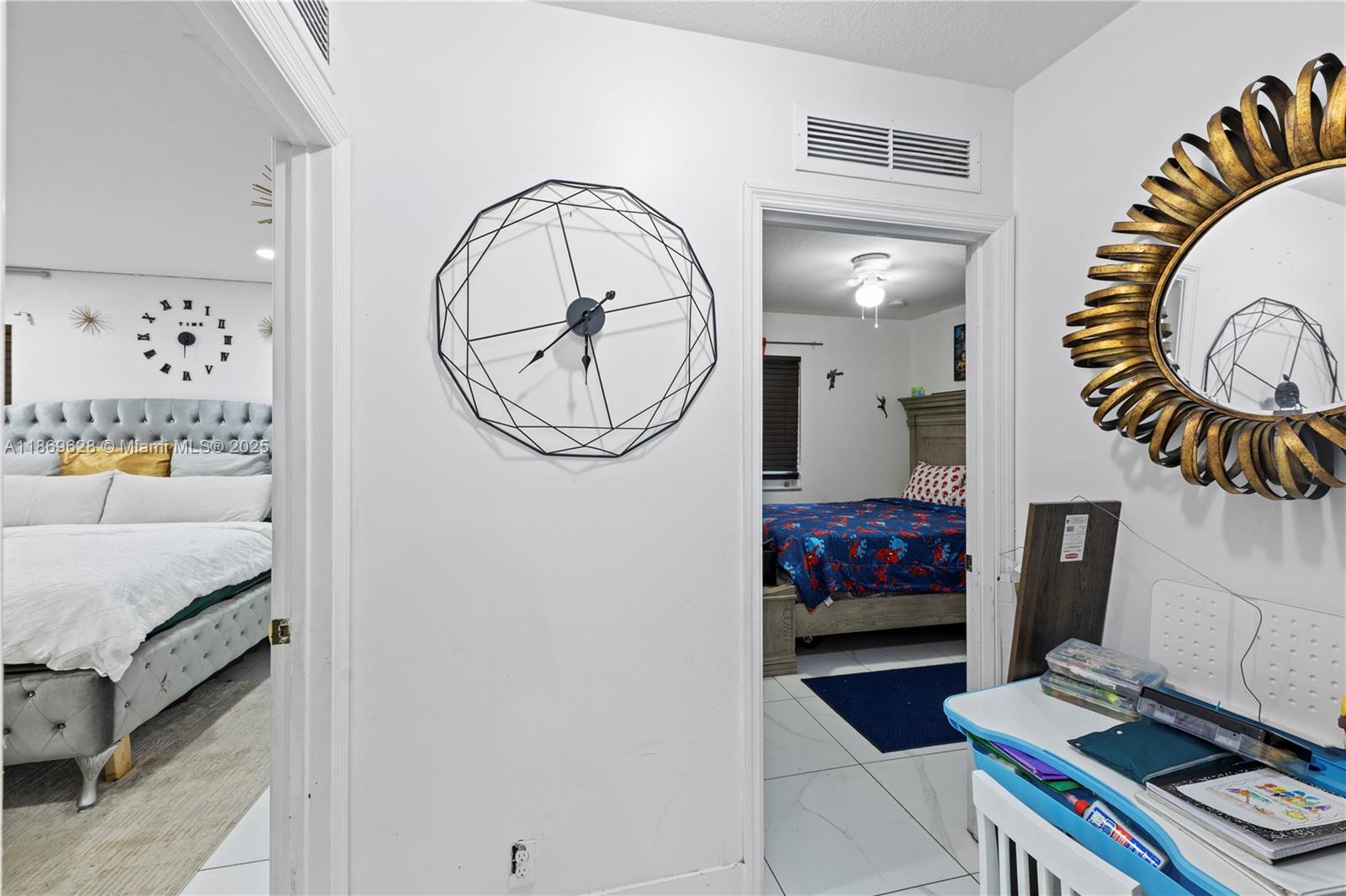 135 Northwest 6th Avenue Dania Beach, FL 33004 - Photo 16 of 26 a living room with furniture and a mirror