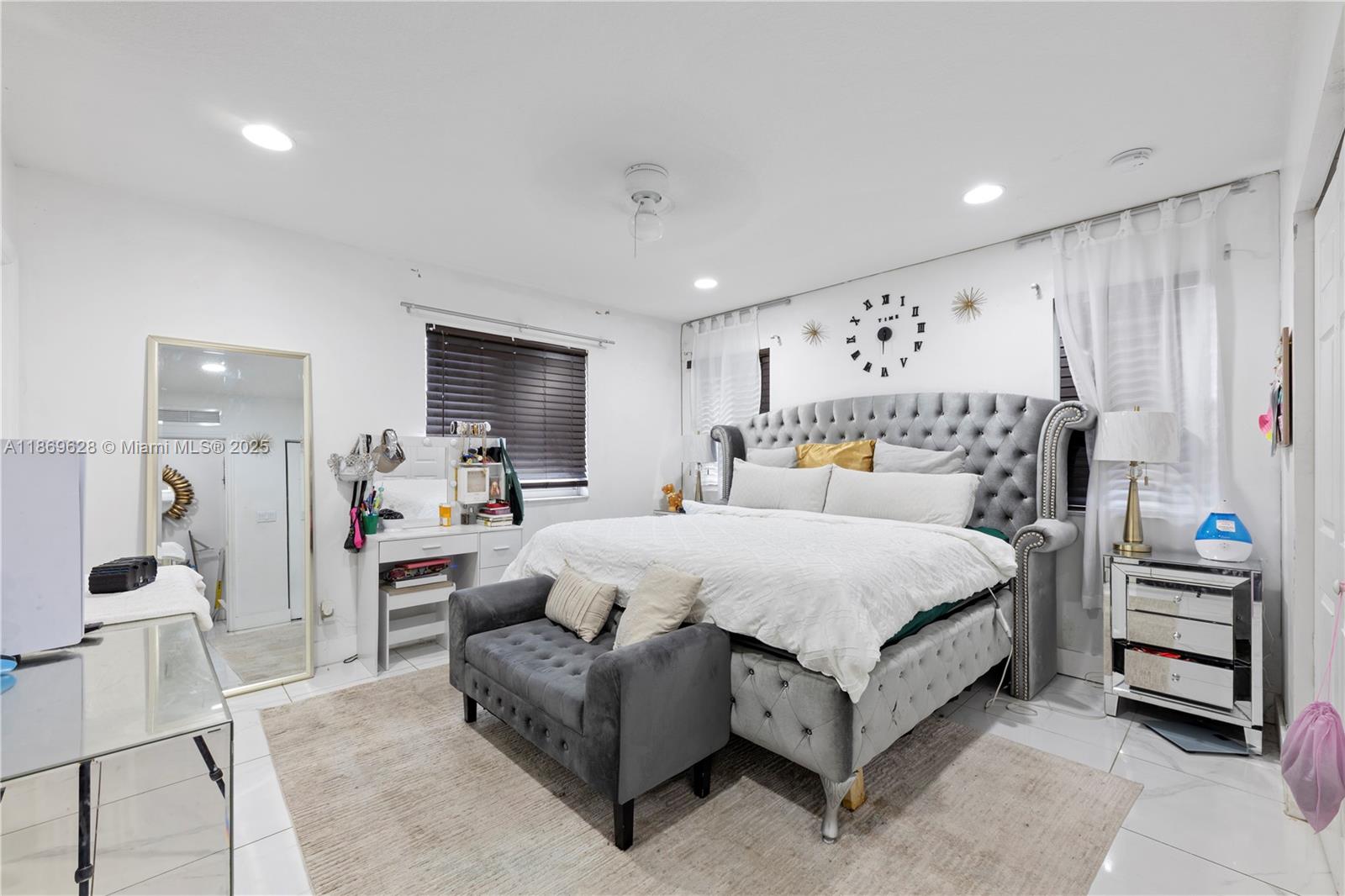 135 Northwest 6th Avenue Dania Beach, FL 33004 - Photo 7 of 26 a bedroom with a bed and window