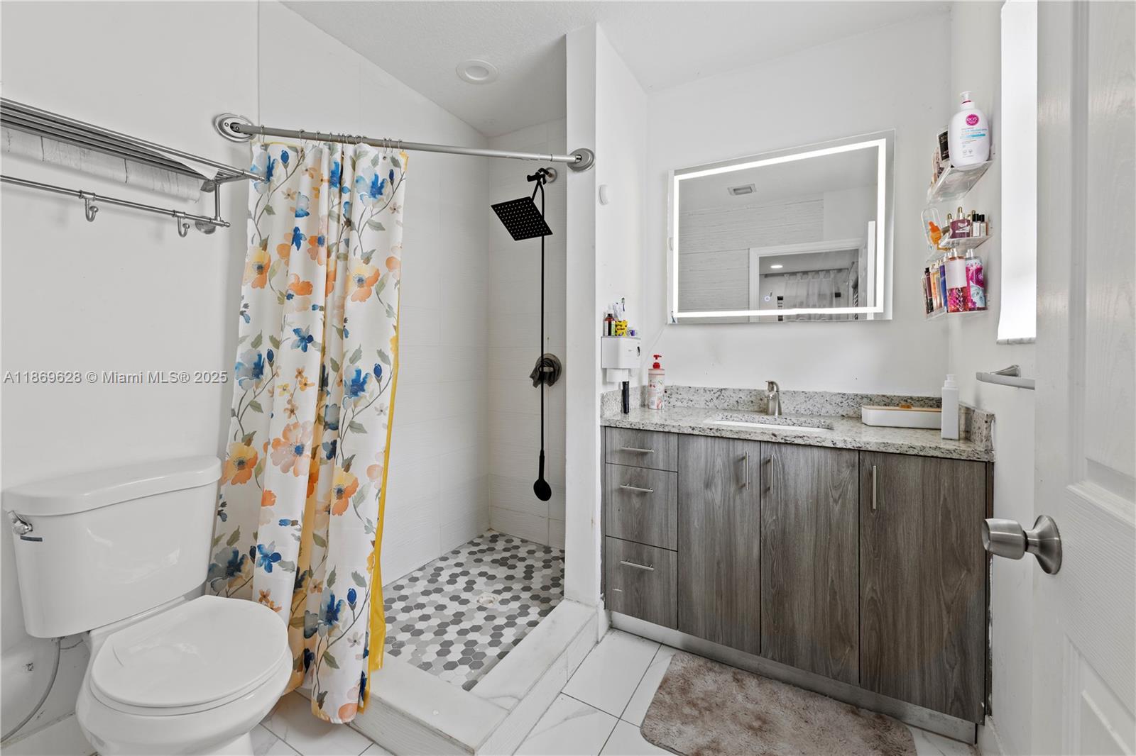 135 Northwest 6th Avenue Dania Beach, FL 33004 - Photo 9 of 26 a bathroom with a sink toilet and shower