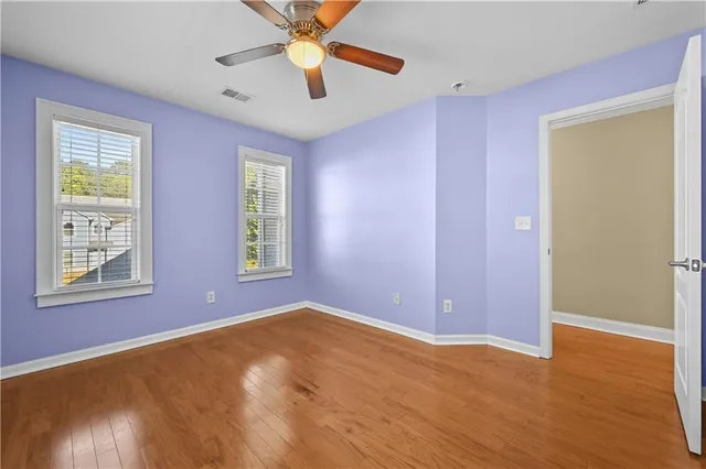 a bathroom with a sink a light fixture and a mirror