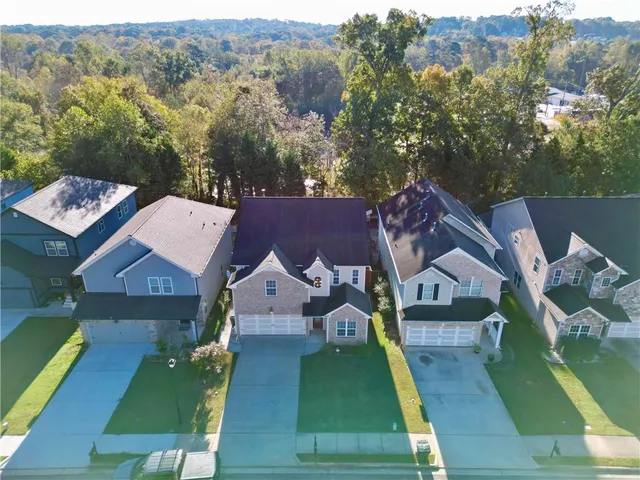an aerial view of a house with a garden