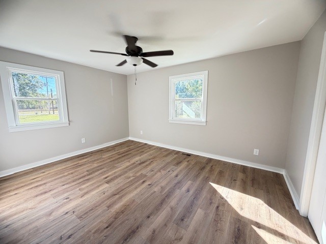 128 Stewart Street Cowan, TN 37318 - Photo 9 of 14 wooden floor in an empty room with a window