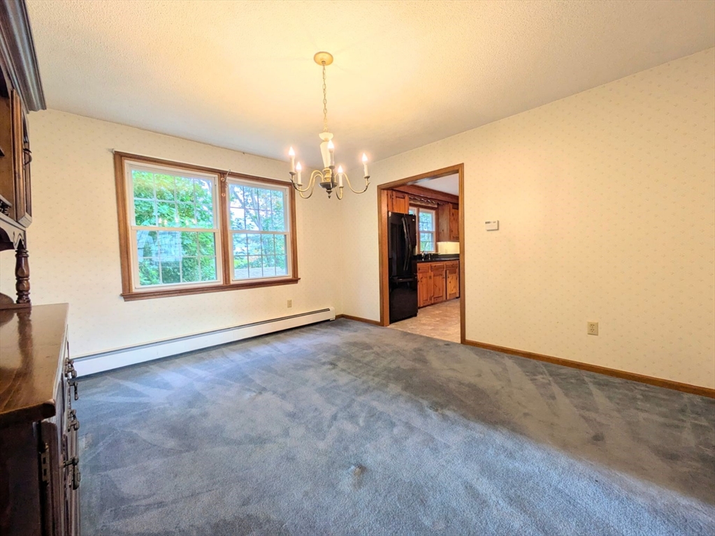 34 Leeds Terrace Lawrence, MA 01843 - Photo 17 of 27 an empty room with windows and ceiling fan