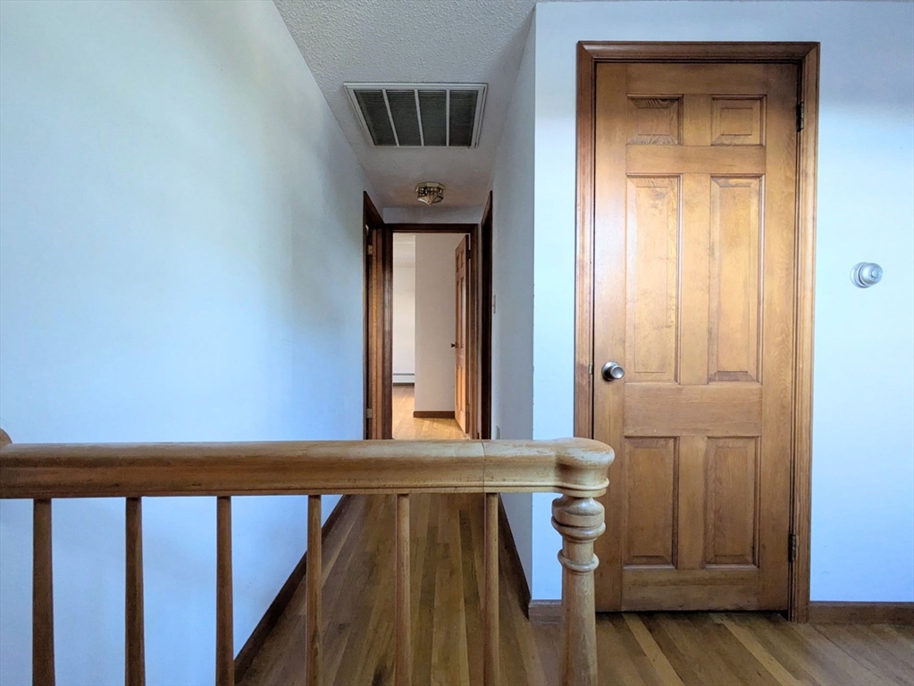34 Leeds Terrace Lawrence, MA 01843 - Photo 19 of 27 a view of a hallway with wooden floor and closet