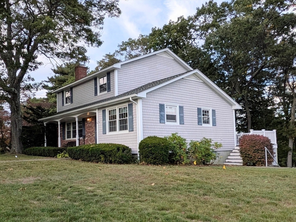 34 Leeds Terrace Lawrence, MA 01843 - Photo 2 of 27 a front view of a house with a yard