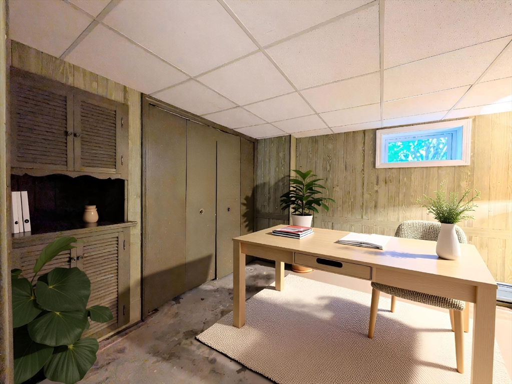 34 Leeds Terrace Lawrence, MA 01843 - Photo 8 of 27 a workspace with furniture and a fireplace