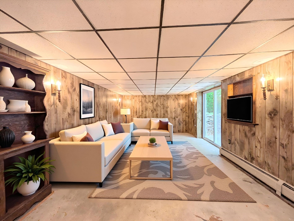 34 Leeds Terrace Lawrence, MA 01843 - Photo 9 of 27 a living room with furniture and a flat screen tv