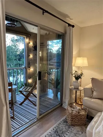 a bedroom with furniture and large windows