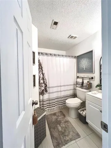 a view of room with window and wooden floor