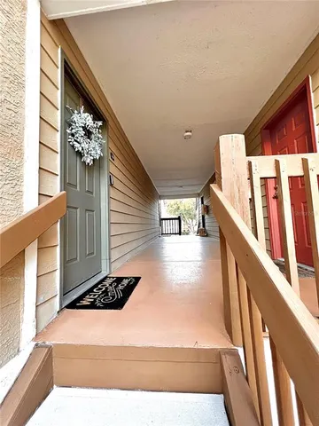a view of a hallway with stairs