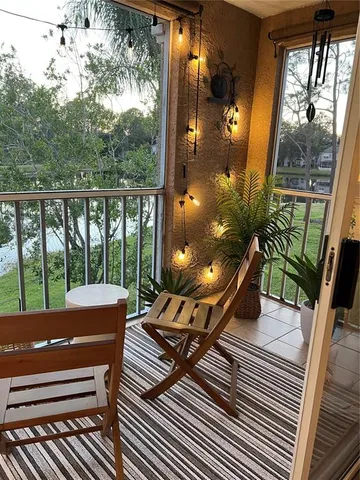 a view of a balcony with wooden floor