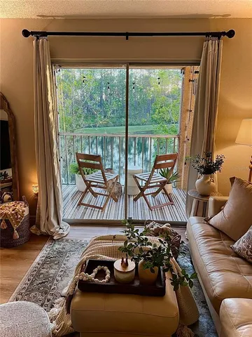 a bedroom with a bed and glass walk in closet