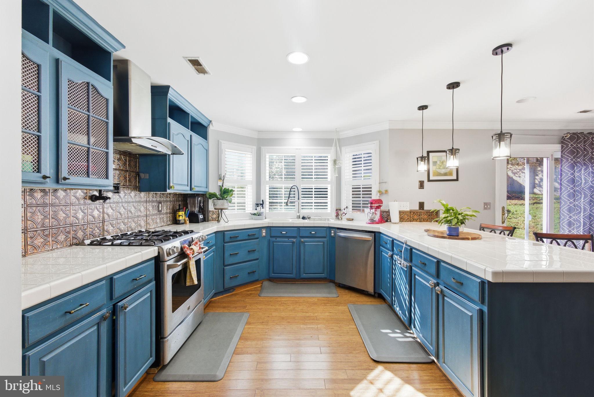 44913 Widgeon Place Callaway, MD 20620 - Photo 12 of 49 a large kitchen with stainless steel appliances granite countertop a stove and large cabinets