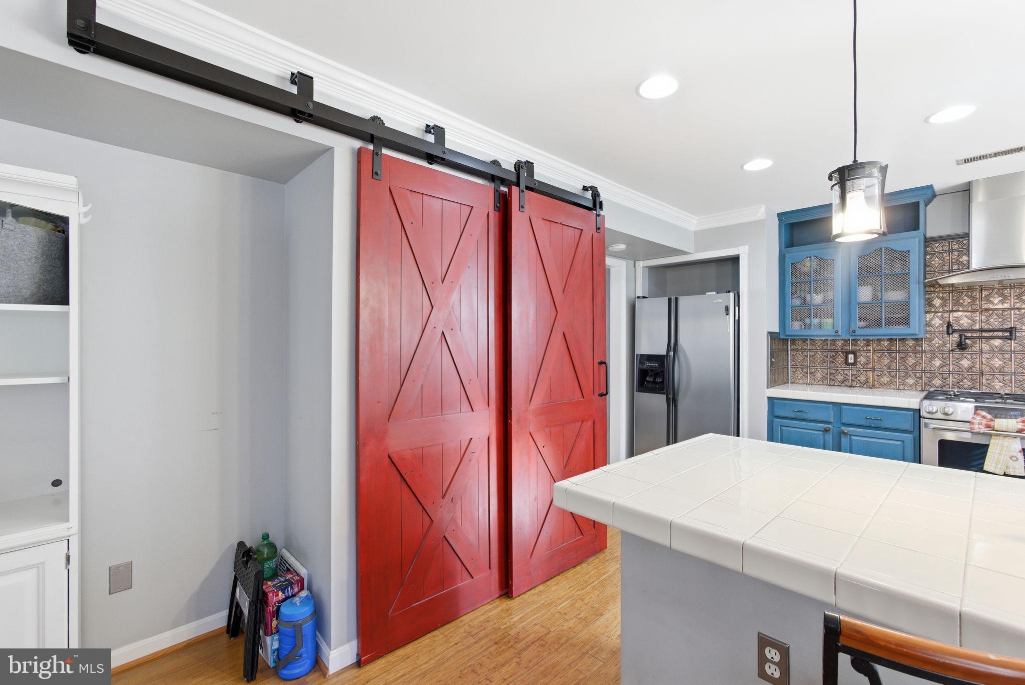 44913 Widgeon Place Callaway, MD 20620 - Photo 15 of 49 a kitchen with stainless steel appliances kitchen island a refrigerator and a sink