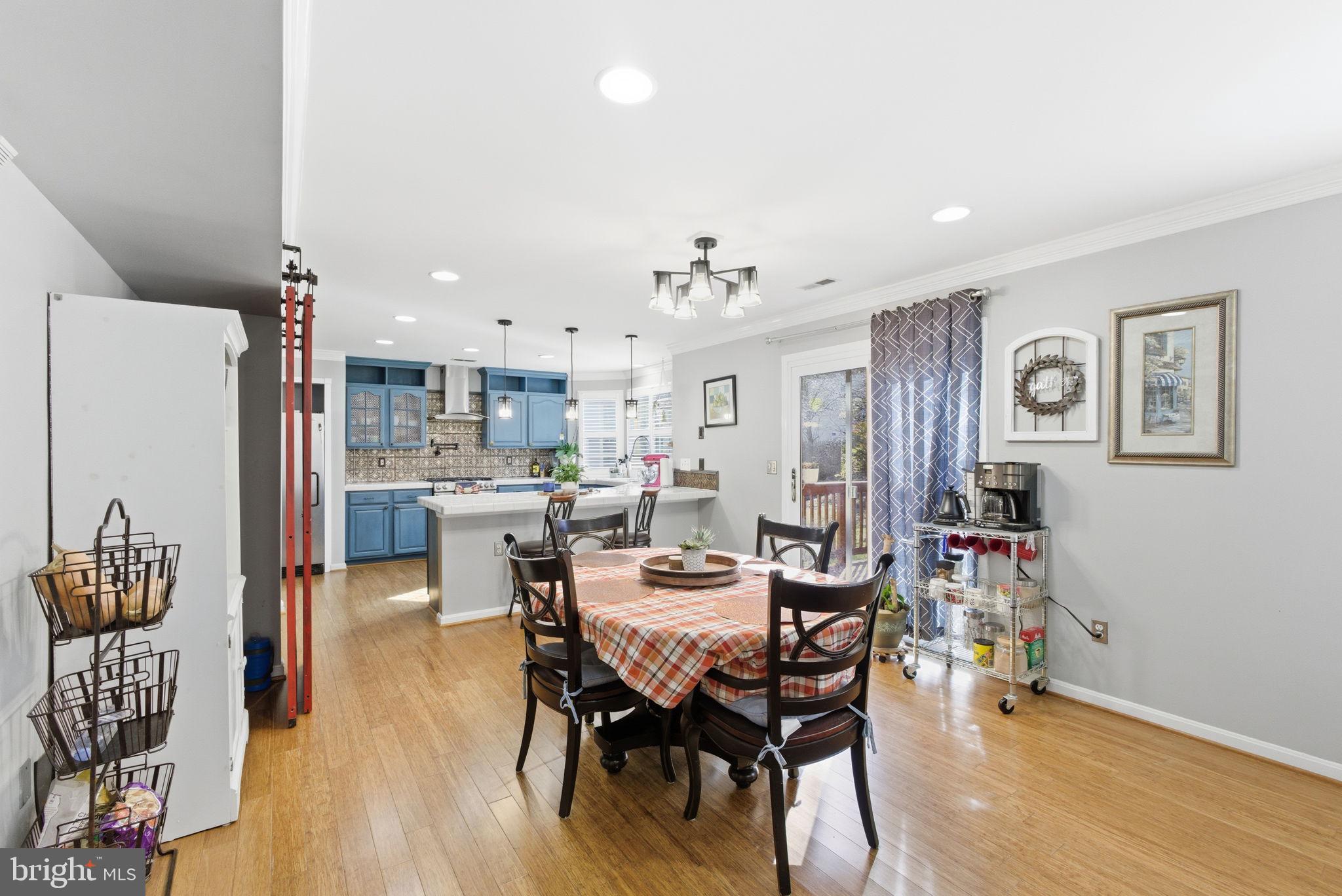 44913 Widgeon Place Callaway, MD 20620 - Photo 18 of 49 a view of a dining room with furniture and wooden floor
