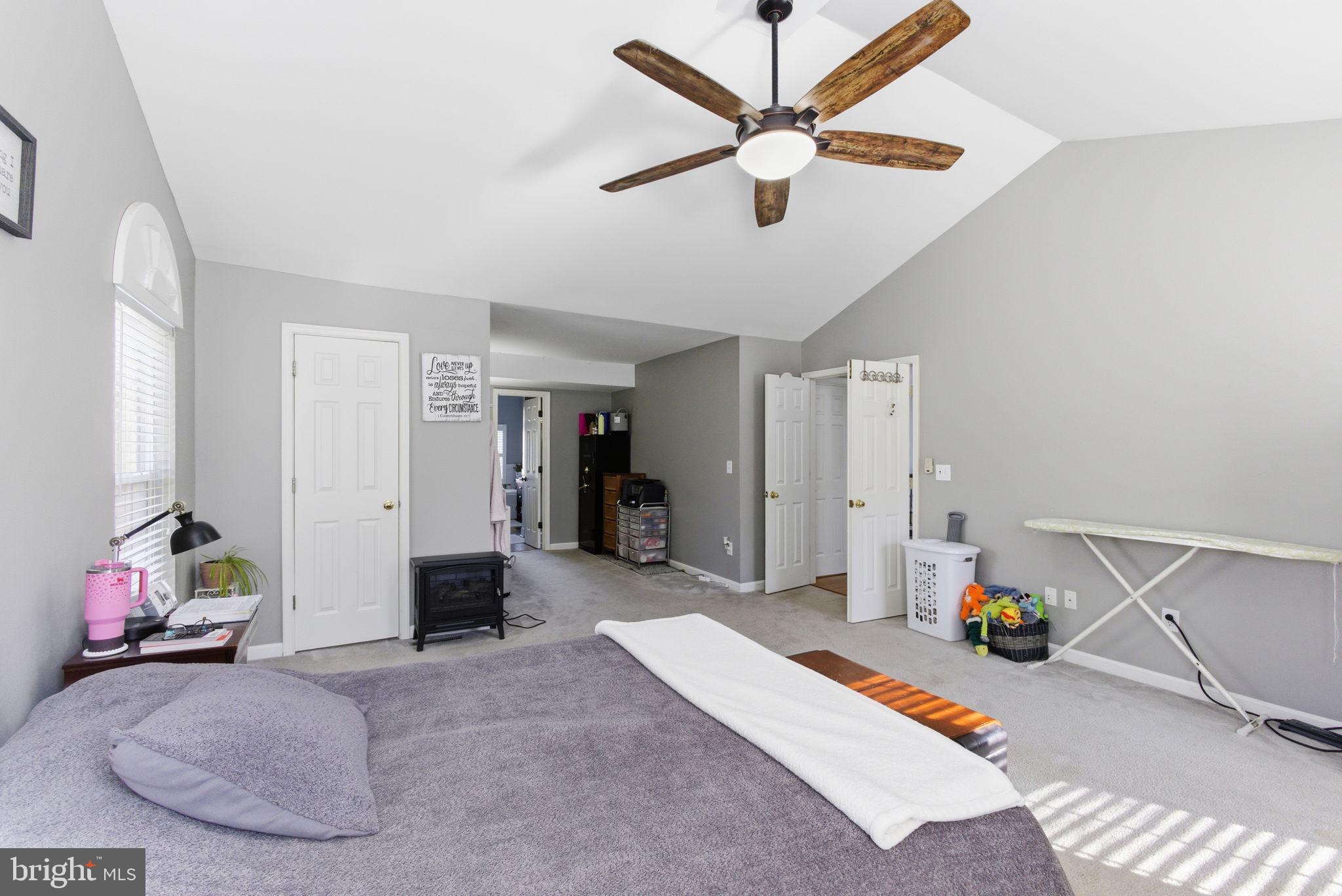 44913 Widgeon Place Callaway, MD 20620 - Photo 29 of 49 a bed room with a bed and a chandelier