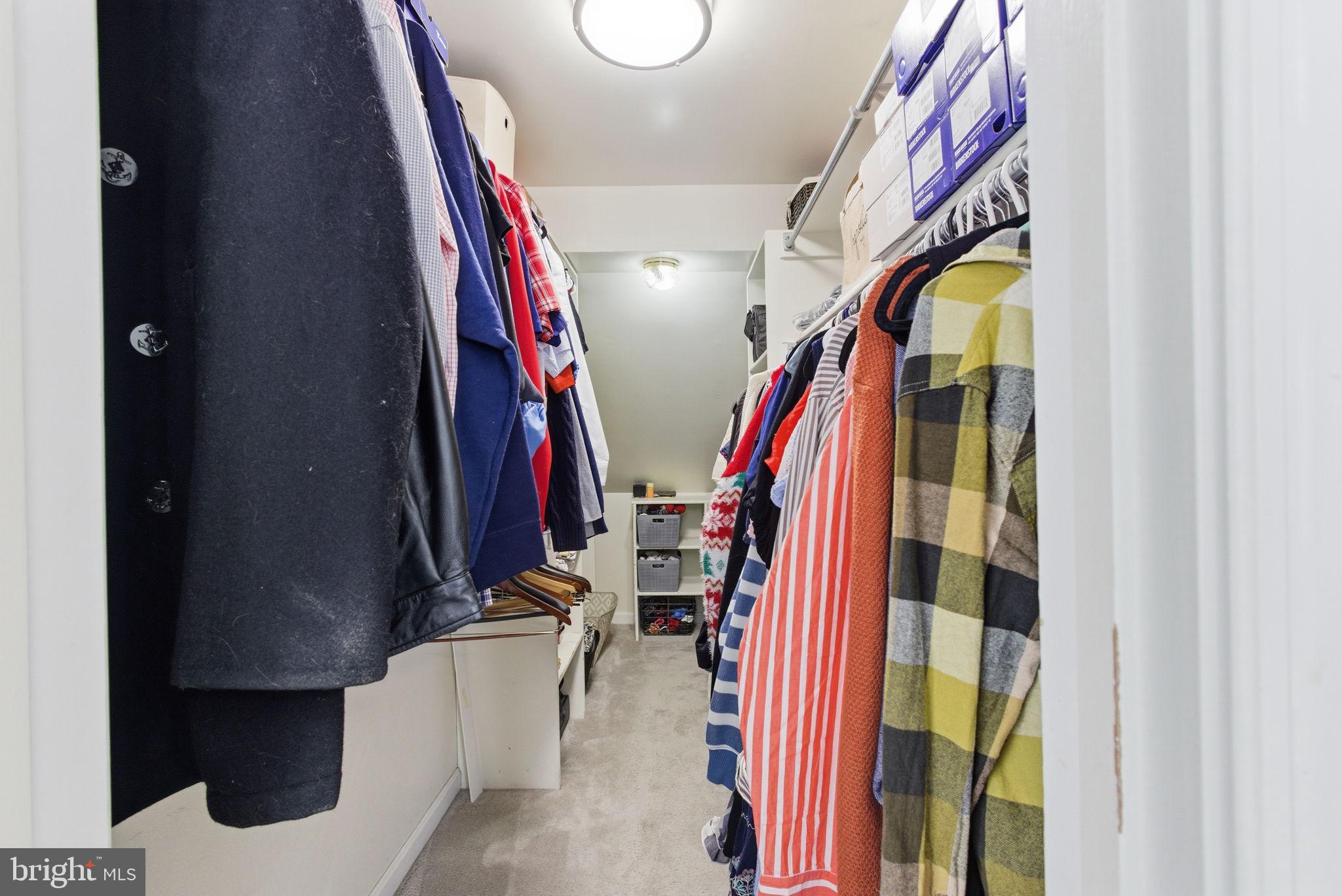 44913 Widgeon Place Callaway, MD 20620 - Photo 30 of 49 a view of walk in closet with clothes and shoes