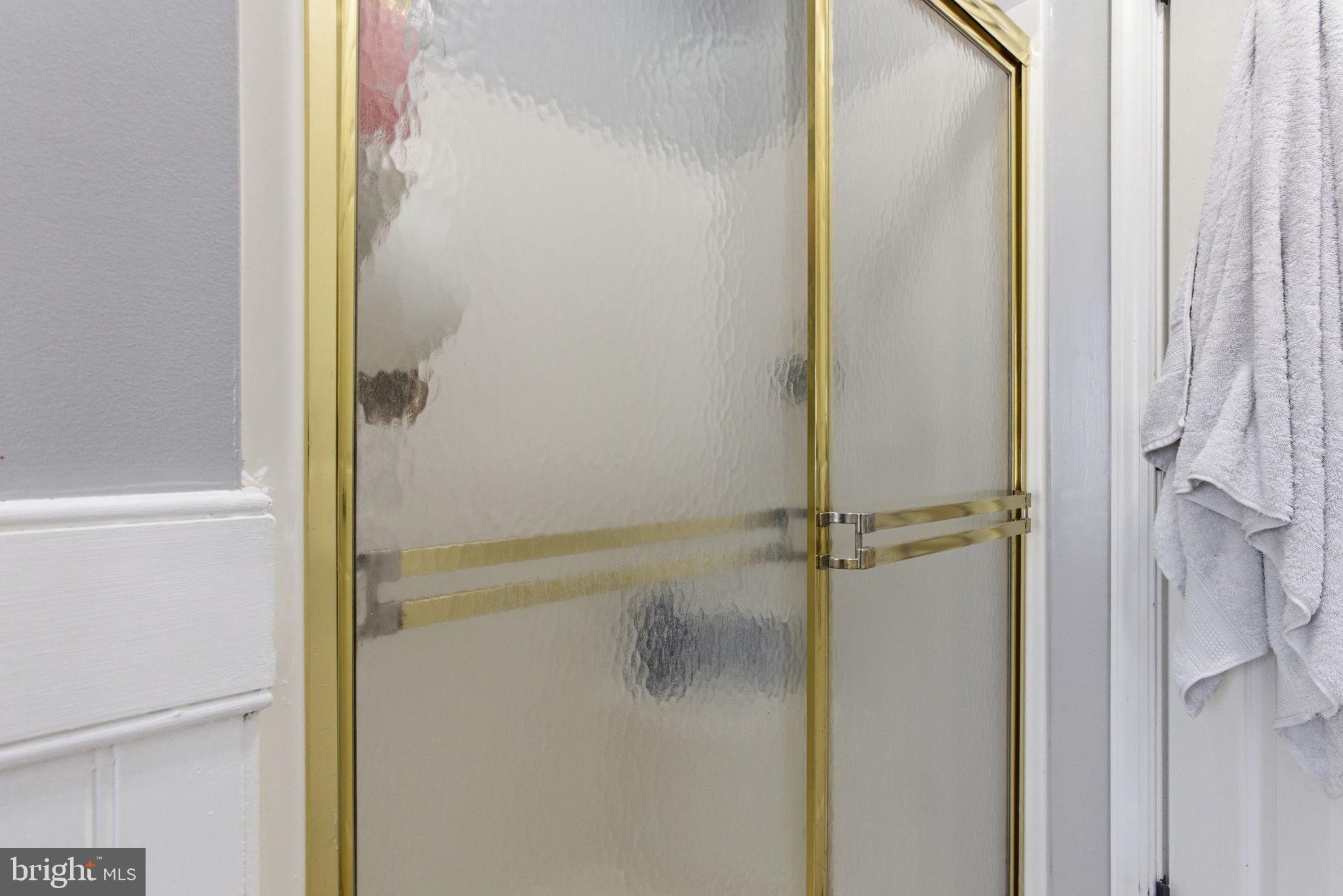 44913 Widgeon Place Callaway, MD 20620 - Photo 34 of 49 a bathroom with a glass shower door