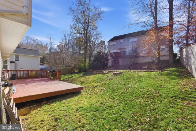 a view of a backyard with sitting area