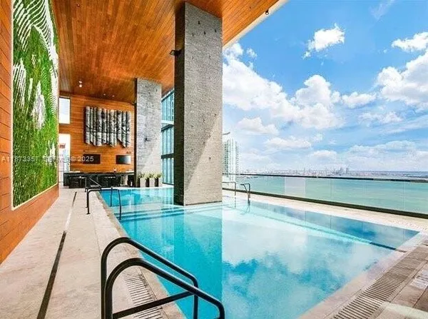 a view of swimming pool from a balcony