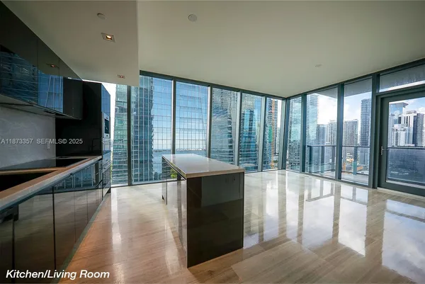 a lobby with furniture and window
