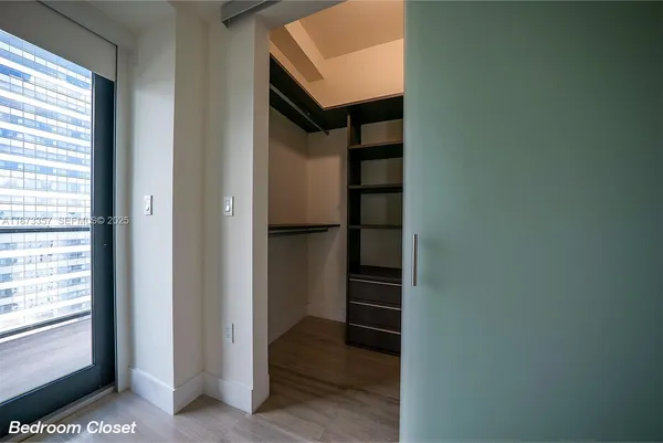 a view of closet area with empty racks