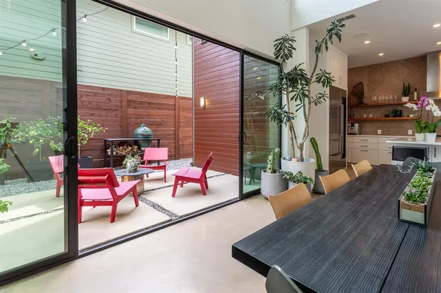 an outdoor living room with furniture