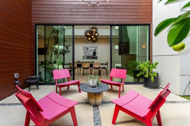 a view of a chairs and table in patio