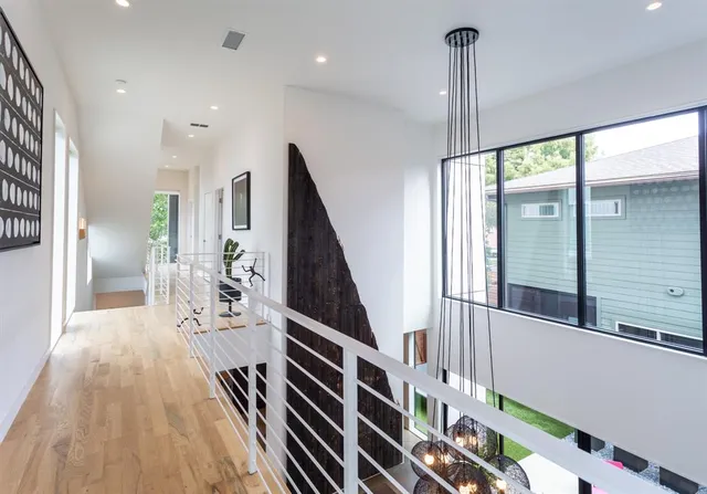 a view of an entryway with wooden floor