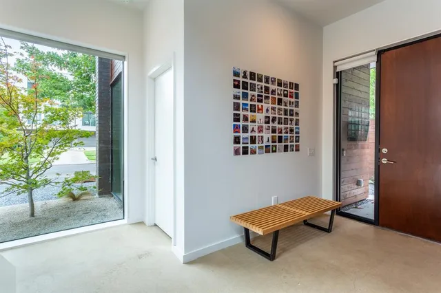 a room with window and a wooden deck