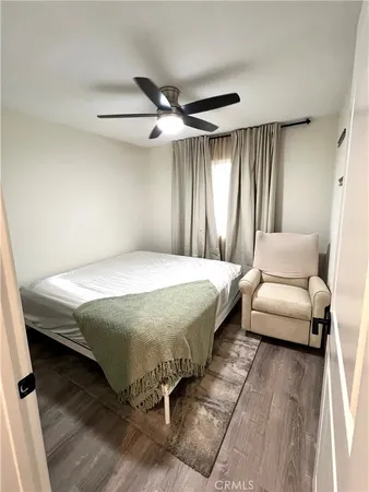 a bedroom with a bed and a couch