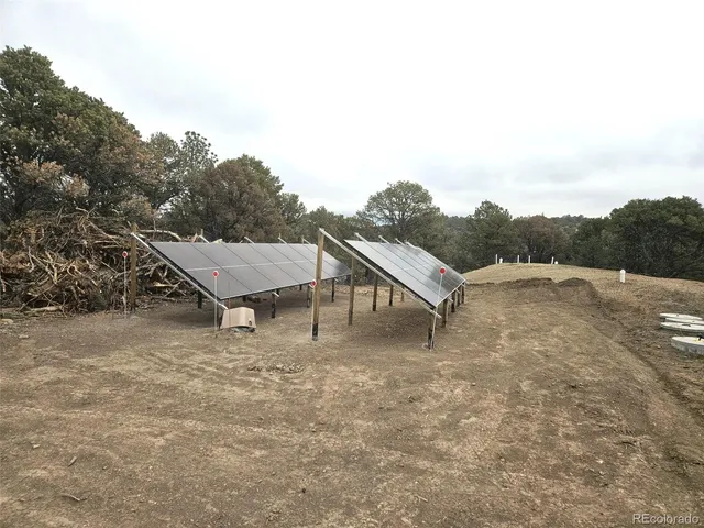 a view of a swimming pool with a table and chairs